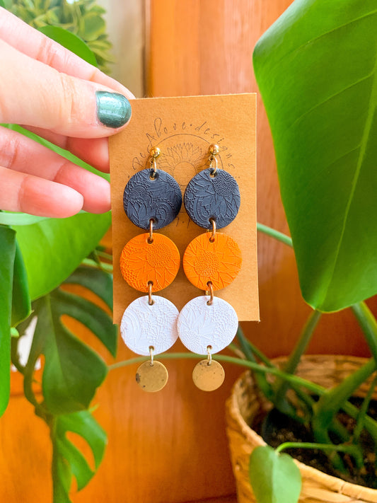 Black, Orange, and White Dangles